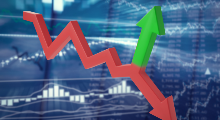 Bifurcating red-green arrow on a blurred background of stock quotes. Unpredictable trend reversal or short squeeze stocks. 3d illustration