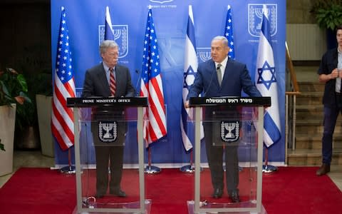 Israeli Prime Minister Benjamin Netanyahu, right, speaks during his meeting with US national security adviser John Bolton at the Prime Minister's office in Jerusalem. - Credit: AP