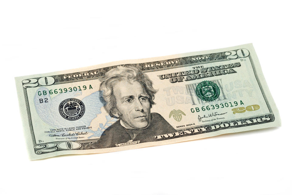 U.S. twenty-dollar bill with Andrew Jackson's portrait angled on a surface