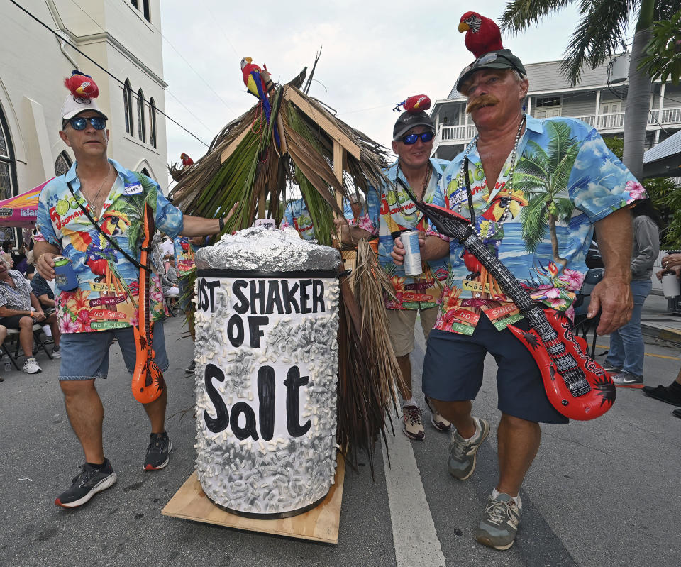 In this Friday, Oct. 27, 2023, photo provided by the Florida Keys News Bureau, late singer/songwriter Jimmy Buffett is remembered with a tribute during the Fantasy Fest Masquerade March in Key West, Fla. Buffett, a former Key West resident, drew inspiration from the island for many of his most famous songs including the hit "Margaritaville." The Masquerade March was a highlight of the 10-day Fantasy Fest costuming and masking celebration that continues through Sunday, Oct. 29. (Andy Newman/Florida Keys News Bureau via AP)