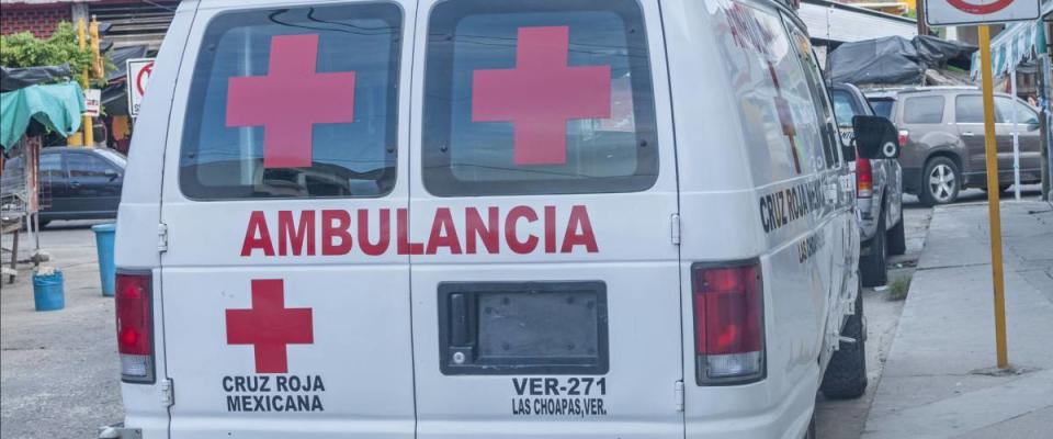 LAS CHOAPAS, MEXICO - JULY 12, 2014: A Mexican Red Cross ambulance is parked on downtown street in Las Choapas, Veracruz.  La Cruz Roja is part of the International Red Cross.