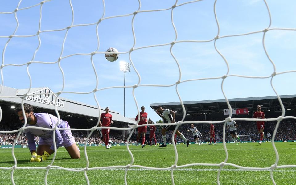 Alisson Becker and Aleksandar Mitrovic - Jurgen Klopp blames players’ attitudes – and dry pitch – for opening-day draw at Fulham - GETTY IMAGES