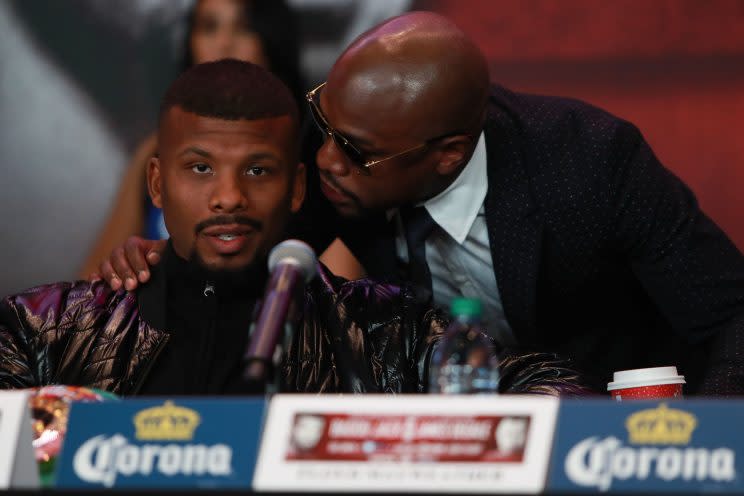 Floyd Mayweather (R) speaks to Badou Jack at a New York news conference. Jack may appear on the Aug. 26 Mayweather-Conor McGregor undercard. (Getty Images)