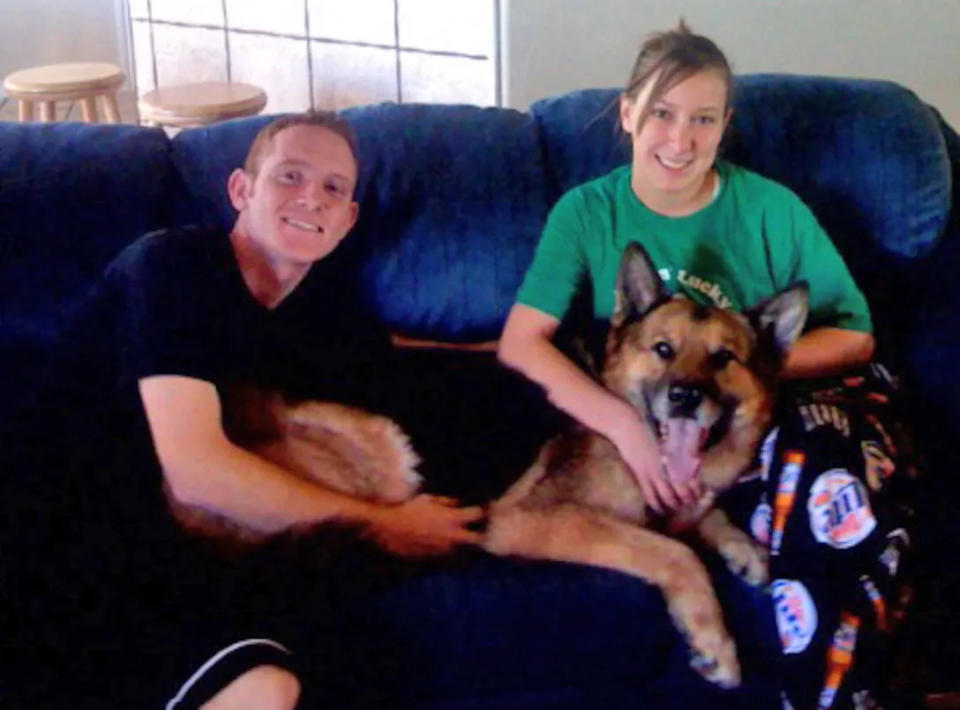 Air Force Base in Alaska pictured Airman Ashli McEntee with her then husband, Sgt. 1st Class Timothy McEntee, after they had adopted her military working dog.