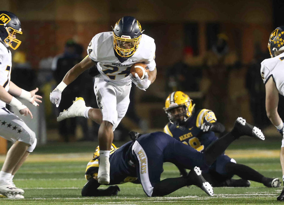 Moeller running back Jordan Marshall runs the ball during the Crusaders' 21-22 loss to Springfield, Friday, Nov. 26. 2021.