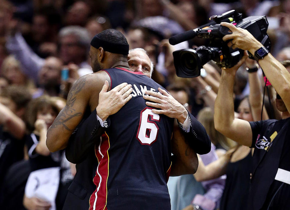 Gregg Popovich of the San Antonio Spurs hugs LeBron James of the Miami Heat after Game 5 of the 2014 NBA Finals. (Andy Lyons/Getty Images)