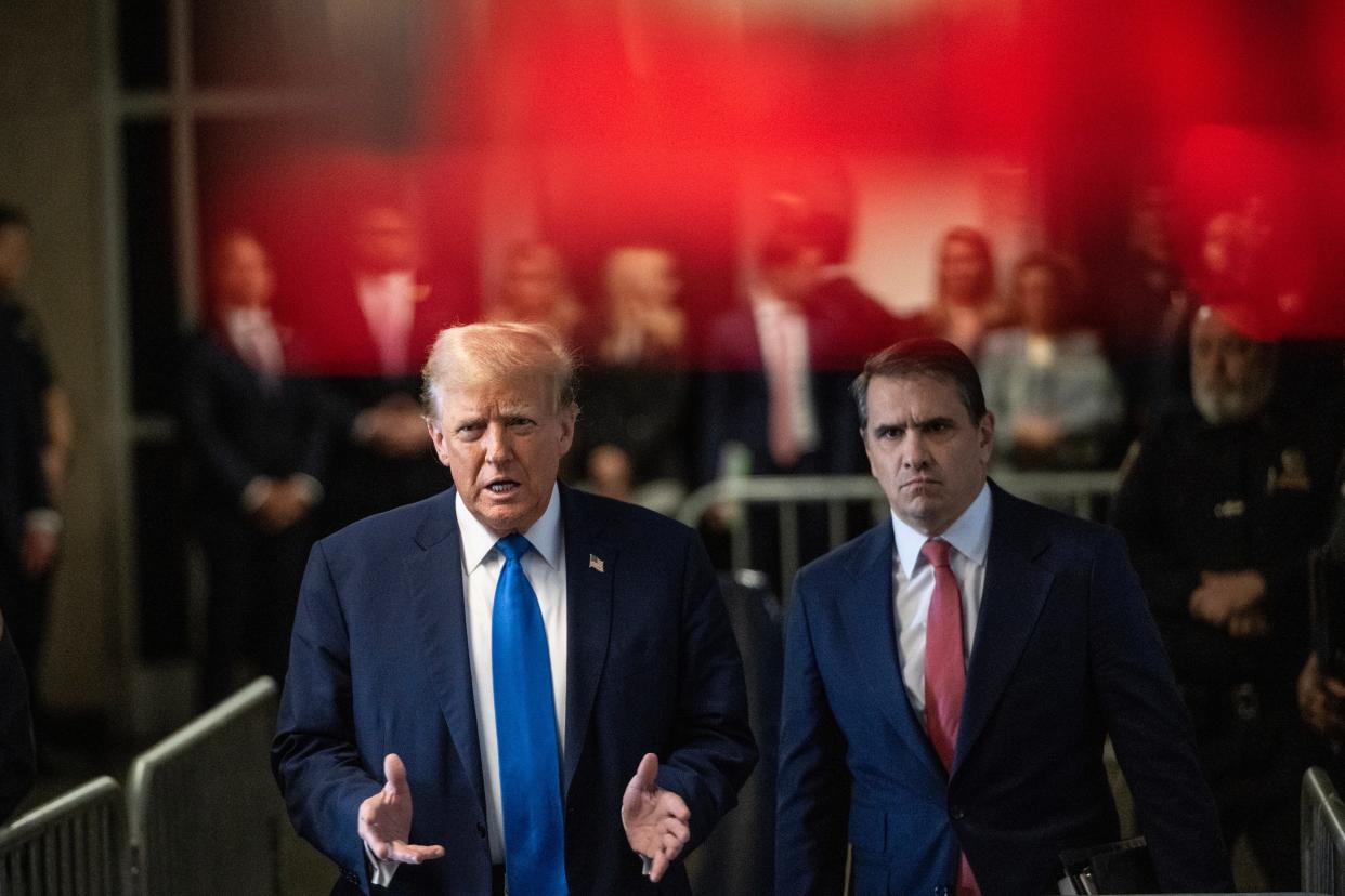 NEW YORK, NEW YORK - APRIL 22: Former U.S. President Donald Trump speaks to the media, flanked by lawyer Todd Blanche (R), after arriving for his trial for allegedly covering up hush money payments at Manhattan Criminal Court on April 22, 2024 in New York City. Trump was charged with 34 counts of falsifying business records last year, which prosecutors say was an effort to hide a potential sex scandal, both before and after the 2016 presidential election. Donald Trump's unprecedented criminal trial is set for opening statements after final jury selection ended Friday. (Photo by Victor J. Blue - Pool/Getty Images)