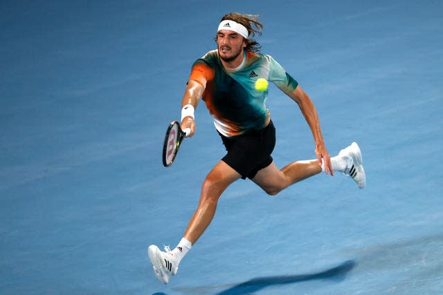 Stefanos Tsitsipas plays a forehand on the run