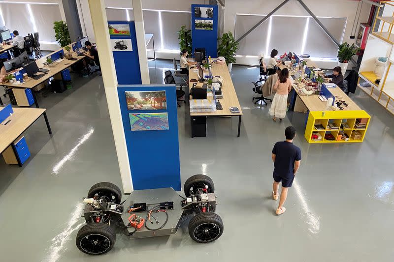 Employees work at the office of autonomous technology company Whale Dynamic in Shenzhen