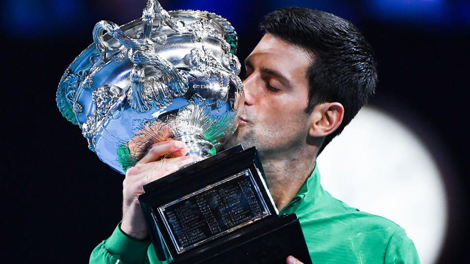 Pictured here, Novak Djokovic with his 2020 Australian Open trophy.