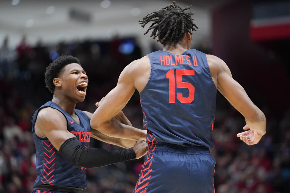 Dayton guard Malachi Smith (11) celebrates after Dayton forward DaRon Holmes II (15) drew a foul after a basket during the first half of an NCAA college basketball game against Robert Morris, Saturday, Nov. 19, 2022, in Dayton, Ohio. (AP Photo/Joshua A. Bickel)