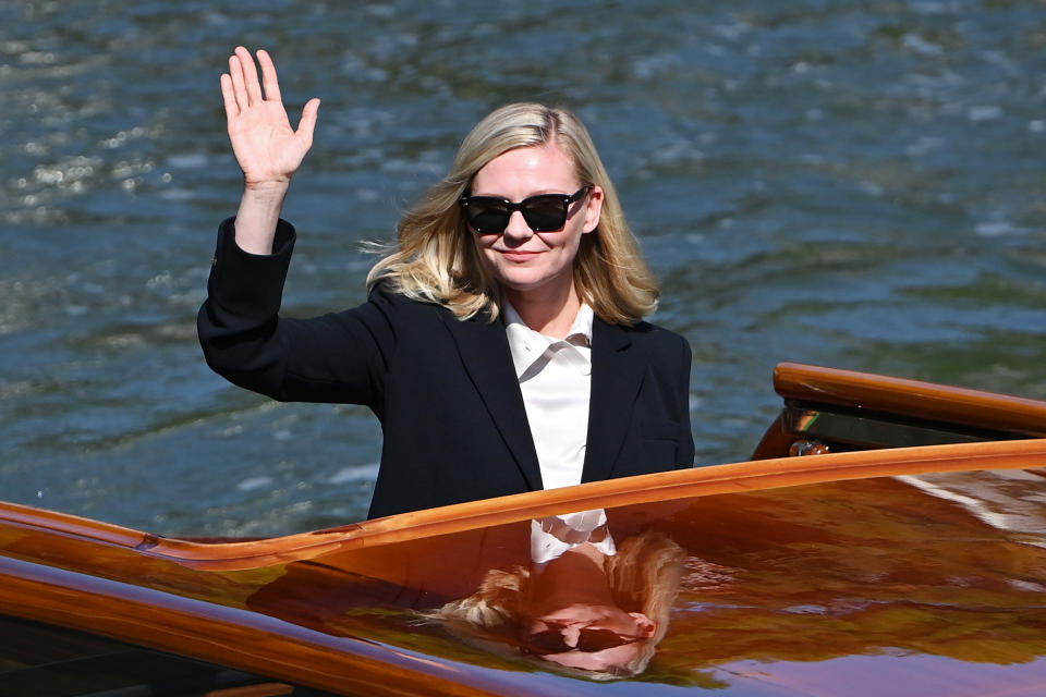 <p>Kirsten Dunst waved to the crowd while arriving at the festival on Sept. 2. </p>