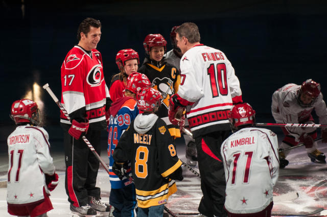 Carolina Hurricanes' Rod Brind'Amour, front, reacts to assisting teammate  Justin Williams on a goal against the Buffalo Sabres during Game 7 of the  NHL Eastern Conference Finals at the RBC Center in