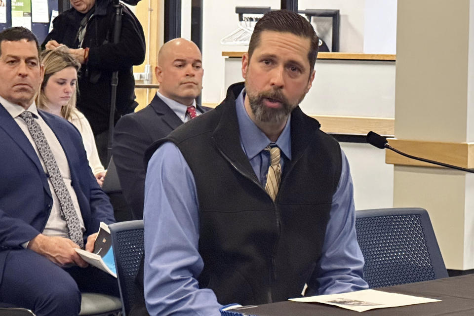 Officer Nathan Morse, of the Lisbon Police Department ,describes the search for a mass shooter after a gunman killed 18 people in Lewiston, Maine, as he testified before an independent commission investigating the shootings, Thursday, Feb. 8, 2024, in Augusta, Maine. (AP Photo/Patrick Whittle)