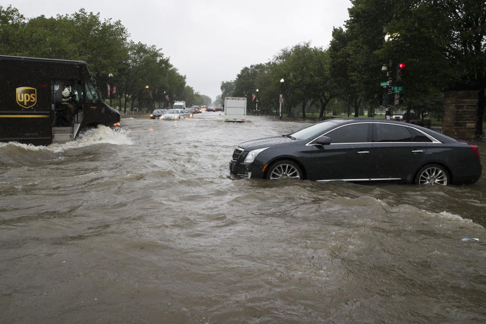 Heavy rainfall flooded the intersection of 15th Street and Constitution Ave., NW stalling cars in the street, Monday, July 8, 2019, in Washington. (Photo: Alex Brandon/AP)