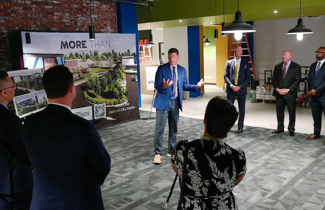 Fresno Mission CEO Matthew Dildine, center, outlines the development of Fresno Mission’s new Heartbeat Hub before a tour Wednesday, Oct. 12, 2022 in Fresno.