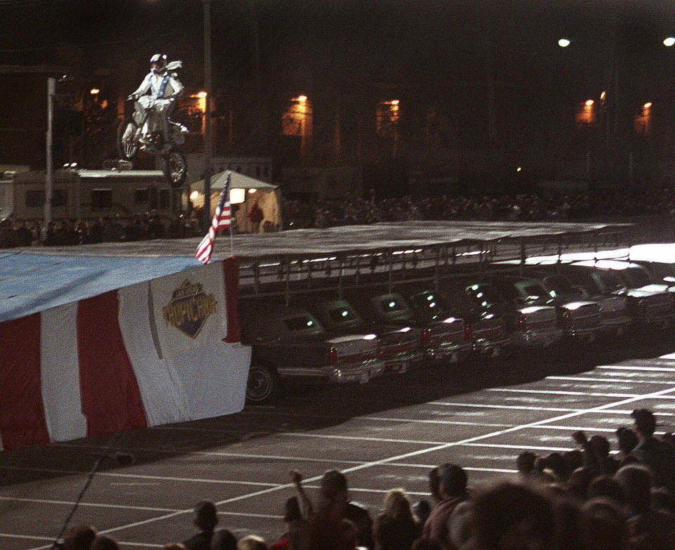 FILE - Robbie Knievel successfully lands after jumping his motorcycle over 30 limousines at the Tropicana Hotel in Las Vegas on Tuesday night, Feb. 24, 1998. When the Tropicana Las Vegas opened in 1957, Nevada's lieutenant governor at the time turned the key to open the door on what would become a Sin City landmark for more than six decades. Then he threw away the key. "This was to signify that the Tropicana would always stay open," said historian Michael Green. Six decades later, the storied hotel-casino that once had ties to the mob and had been nicknamed the "Tiffany of the Strip," is set to shut its doors for good to make room for a $1.5 billion Major League Baseball stadium. (AP Photo/Jeff Scheid, file)