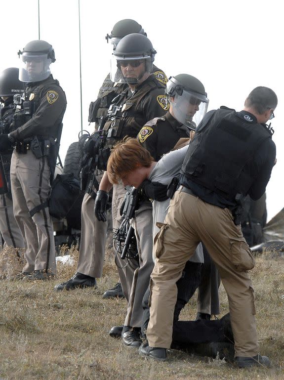 A Dakota Access Pipeline protester is arrested at a new camp on land owned by the pipeline company.