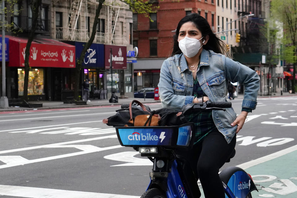 NEW YORK, NEW YORK - APRIL 30:  A woman rides a citibike while wearing a protective mask during the coronavirus pandemic on April 30, 2020 in New York City. COVID-19 has spread to most countries around the world, claiming over 230,000 lives with infections over 3.2 million people.  (Photo by Cindy Ord/Getty Images)