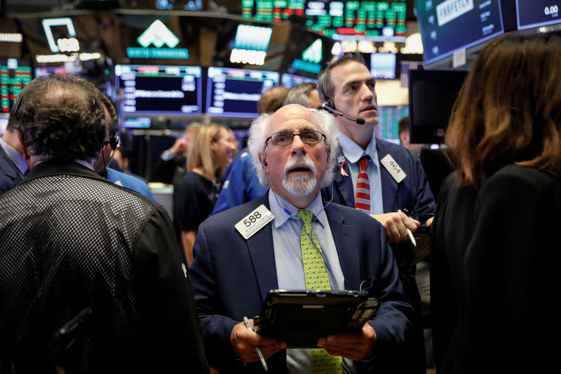 Traders work on the floor of the New York Stock Exchange (NYSE) in New York, U.S., September 21, 2018. REUTERS/Brendan McDermid