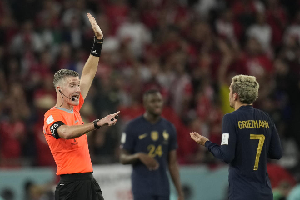 Referee Matthew Conger gestures towards France's Antoine Griezmann as his goal is disallowed during the World Cup group D soccer match between Tunisia and France at the Education City Stadium in Al Rayyan , Qatar, Wednesday, Nov. 30, 2022. (AP Photo/Christophe Ena)