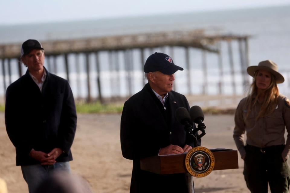 President Joe Biden speaks to the media at Seacliff State Park as California's Governor Gavin Newsom, left, looks on, (REUTERS)