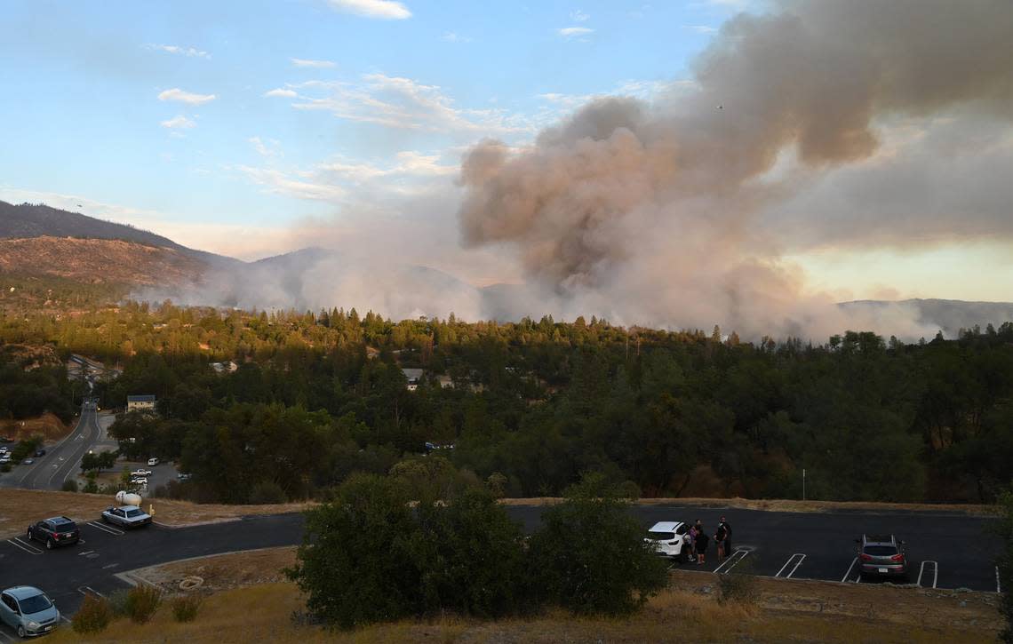 The Fork Fire burns near North Fork, pictured in the foreground, on Wednesday, Sept. 7, 2022. ERIC PAUL ZAMORA/ezamora@fresnobee.com