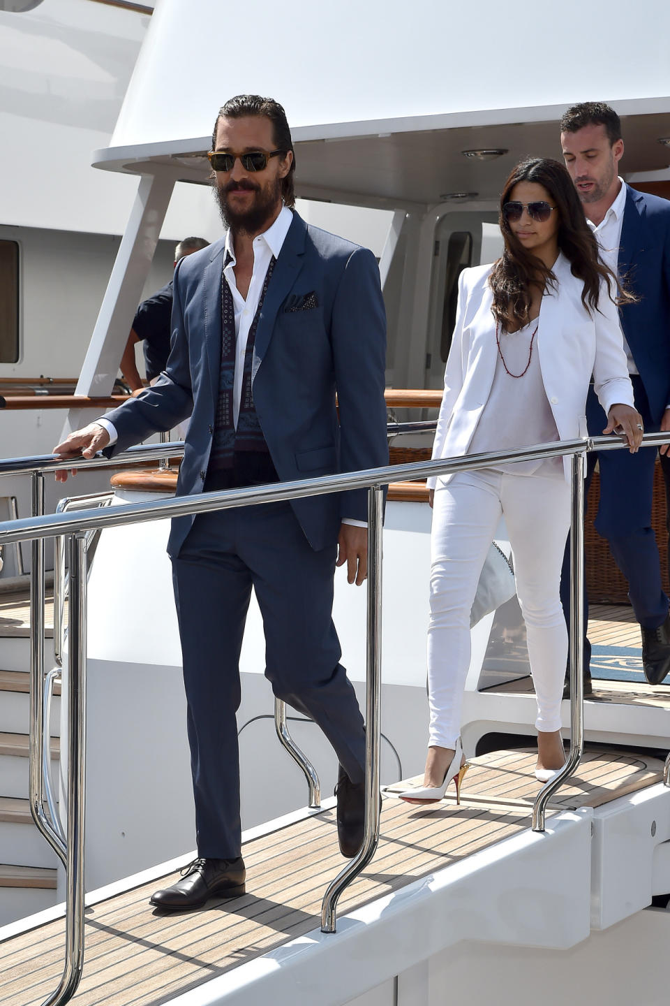 McConaughey looked ultra European in a blue suit and white shirt topped off with a sash. Meanwhile, Alves’s all-white look—fitted blazer, basic tank, and sophisticated sling-backs—is what everyone wants to wear this summer.