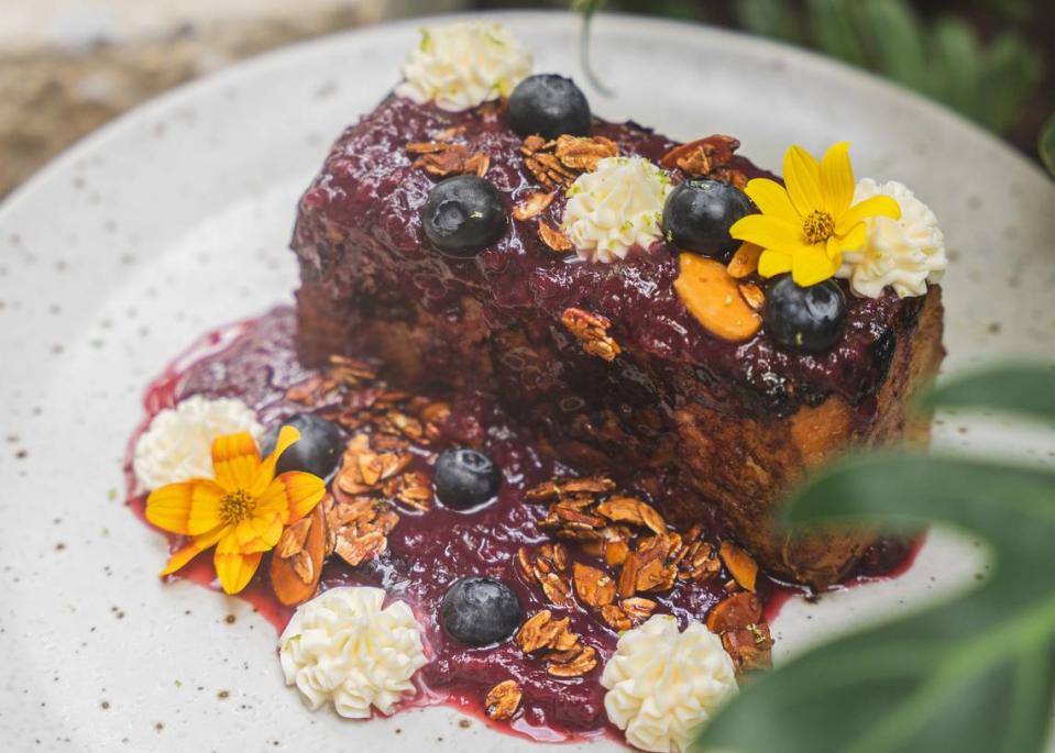 Yuzu French toast smothered in berry compote is one of the breakfast items at Flora Plant Kitchen in Miami.
