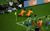 Ivory Coast's Gervinho (L) and Didier Drogba celebrate their goal against Japan during their 2014 World Cup Group C soccer match at the Pernambuco arena in Recife June 14, 2014. REUTERS/Ruben Sprich