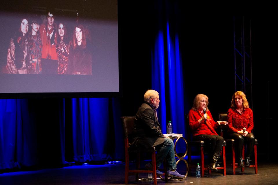 Mary and Ginger Holladay speak about recording with Elvis Presley at American Sound in 1969 with host Tom Brown as a photo of them with Elvis, Mary is on the far left and Ginger on the far right, is shown behind them during the “Conversations on Elvis” event at The Guest House at Graceland as part of the Elvis Birthday Celebration in Memphis, Tenn., on Saturday, January 6, 2024.