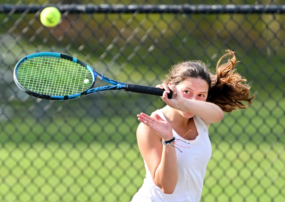 Falmouth number one doubles player Maia Ledwell returns a Barnstable shot.