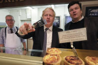 Britain's Prime Minister Boris Johnson visits a bakery during a General Election campaign trail stop in Wells, England, Thursday, Nov. 14, 2019. Britain goes to the polls on Dec. 12. (AP Photo/Frank Augstein, Pool)