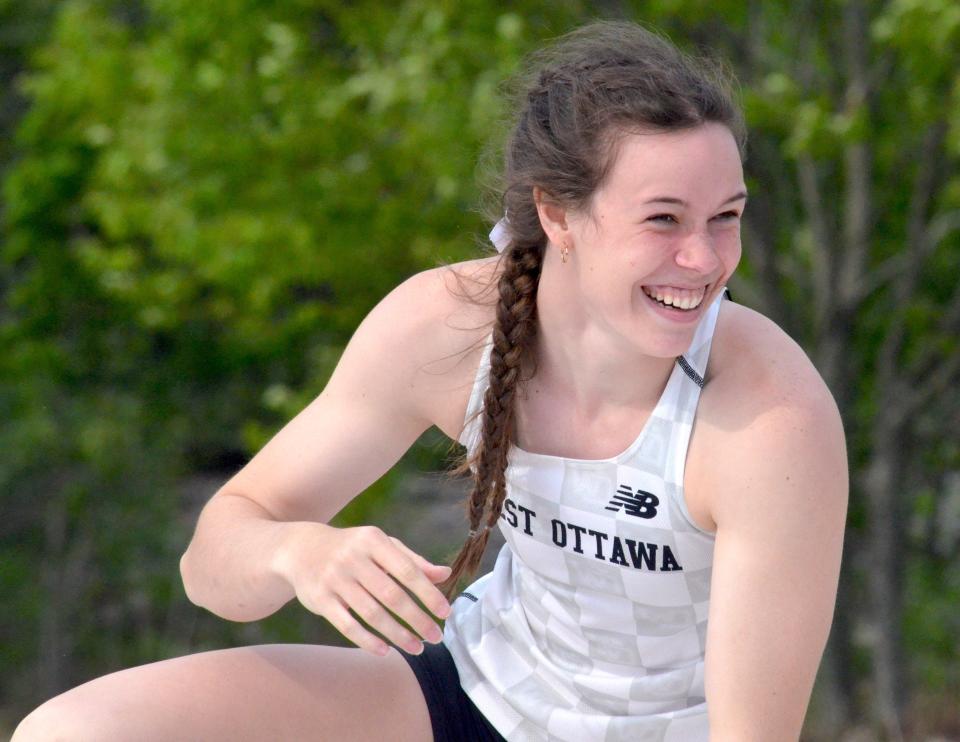 West Ottawa's Natalie Blake reacts to breaking her school record in the pole vault.