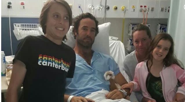 Mr Travaglini (pictured with his family) needed surgery to both legs. Photo: GoFundMe