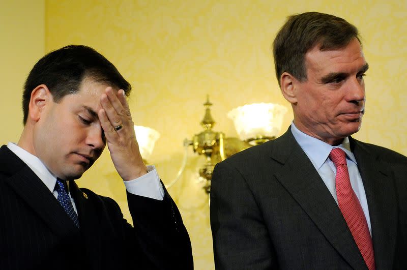 FILE PHOTO: Marco Rubio and Mark Warner attend a news conference unveiling Startup 2.0 legislation aimed at encouraging job growth through innovation and entrepreneurship, at the U.S. Capitol in Washington