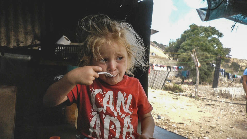 Ximena eating in the Iglesia Embajadores de Jesús shelter in Tijuana, Baja California, Mexico in July 2021. (Noticias Telemundo Investiga)