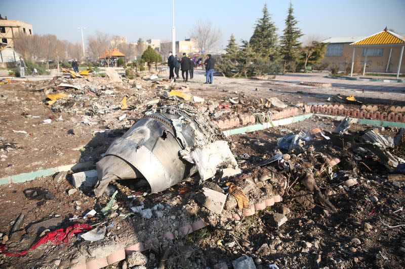 Debris of a plane belonging to Ukraine International Airlines, that crashed after taking off from Iran's Imam Khomeini airport, is seen on the outskirts of Tehran