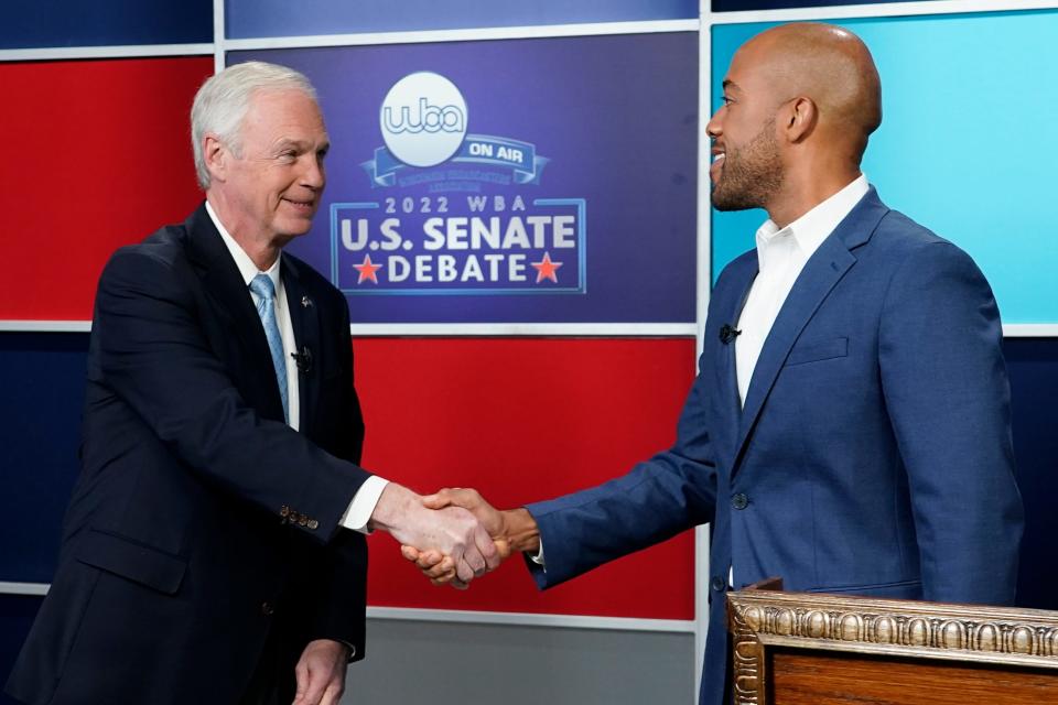 U.S. Sen. Ron Johnson, R-Wis., and his Democratic challenger Mandela Barnes shake hands before a televised debate, Friday, Oct. 7, 2022, in Milwaukee.