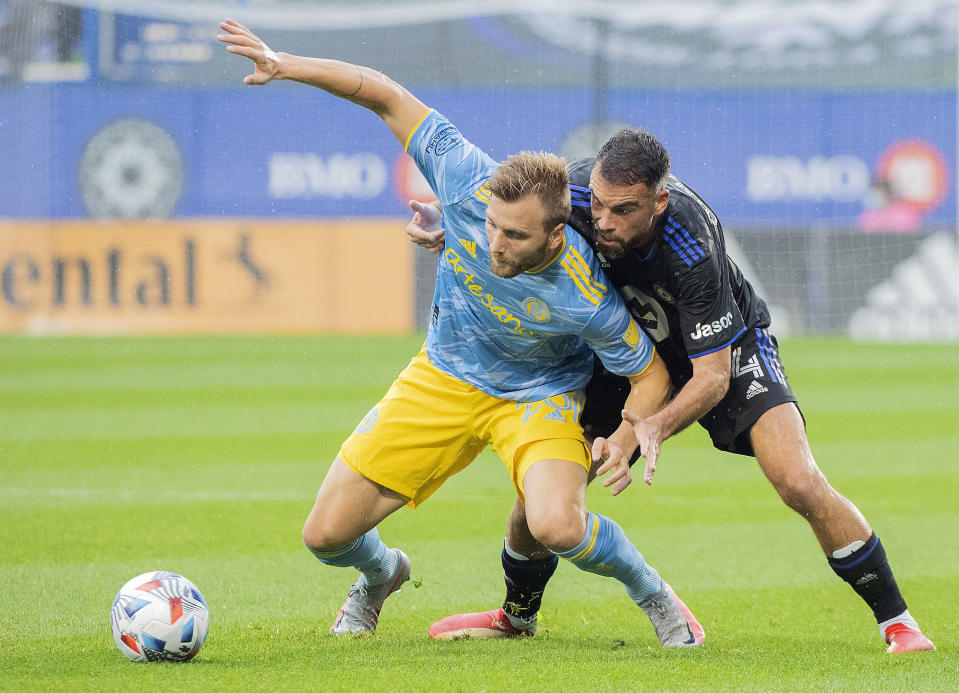 CF Montreal's Rudy Camacho, right, defends against Philadelphia Union's Kacper Przybylko during the first half of an MLS soccer game, Saturday, Oct. 16, 2021, in Montreal. (Graham Hughes/The Canadian Press via AP)