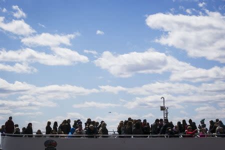 Passengers disembark from a Statue of Liberty Island ferry boat in lower Manhattan in New York April 24, 2015. REUTERS/Lucas Jackson