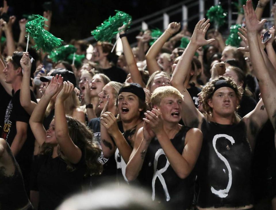 Catawba Ridge students cheer during a Friday night football game at The Pit.