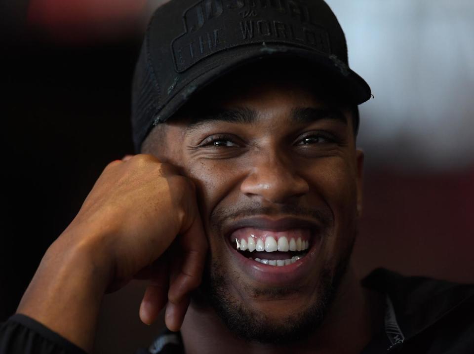 Anthony Joshua vs Carlos Takam: British heavyweight defends WBA and IBF titles by stopping Takam in the tenth round