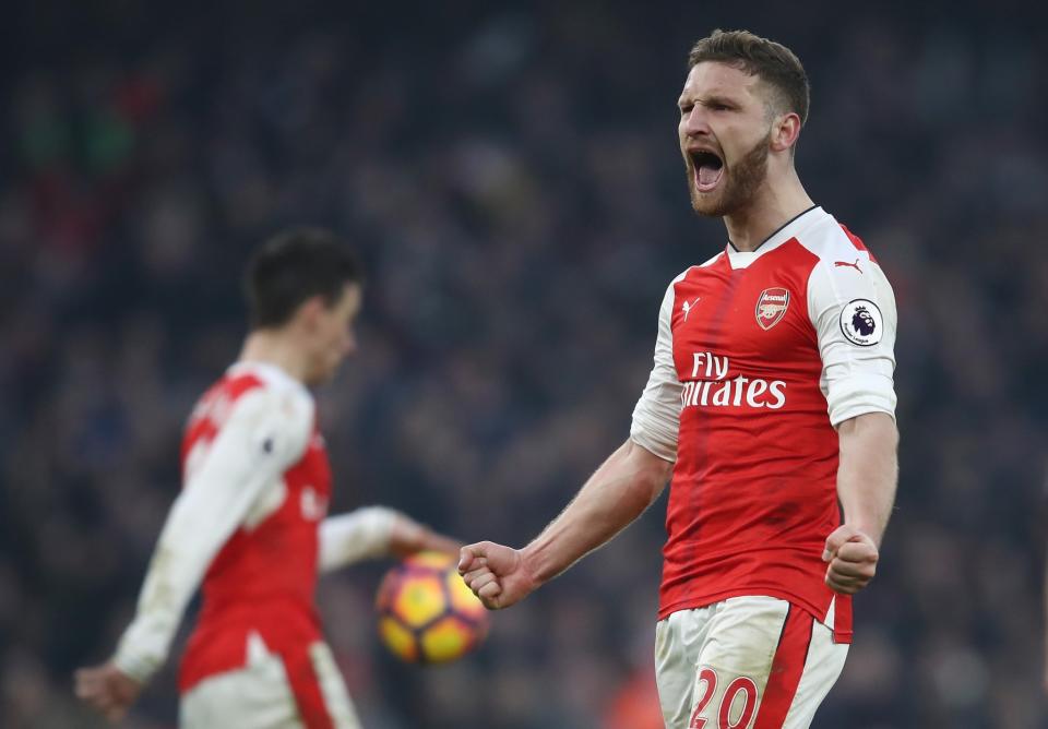 <p>Mustafi celebrates after Sanchez’s coolly taken winner </p>