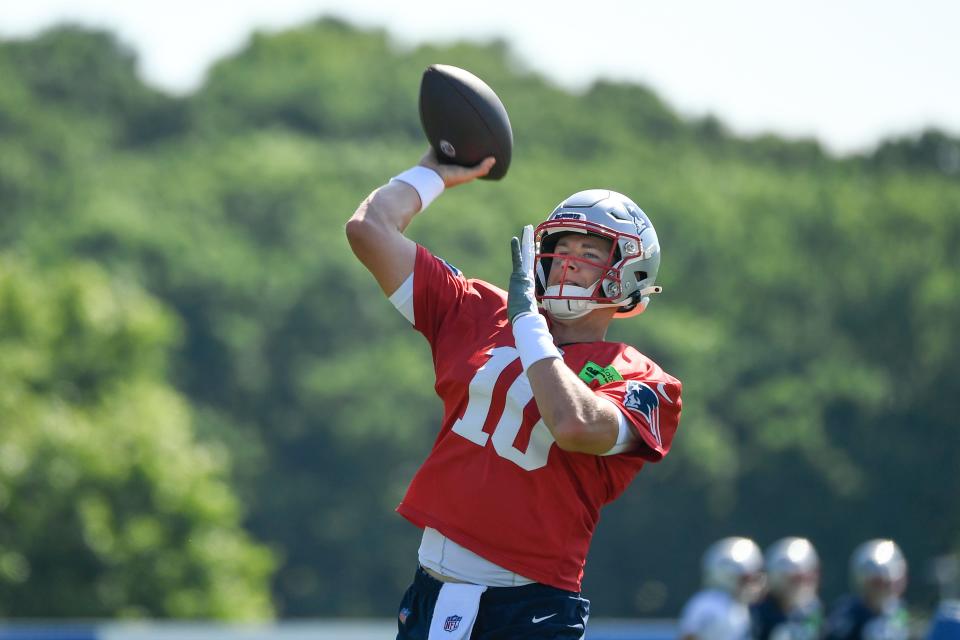 New England Patriots quarterback Mac Jones throws a pass at the Patriots training camp at Gillette Stadium