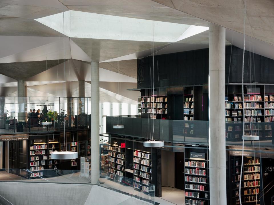 Inside the Deichman Bjørvika Public Library, books, angles, and concrete abound.