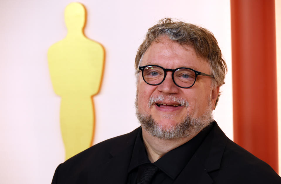 Guillermo del Toro smiling on the Oscars red carpet