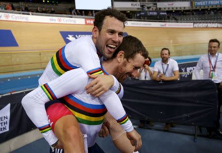 UCI World Track Cycling Championships - London, Britain - 6/3/2016 - Mark Cavendish (L) and Sir Bradley Wiggins (R) of Britain celebrate winning the men's madison final. REUTERS/Matthew Childs