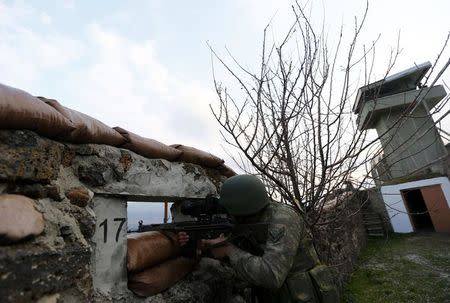 A Turkish soldier participates in an exercise on the border line between Turkey and Syria near the southeastern city of Kilis, Turkey, March 2, 2017. REUTERS/Murad Sezer