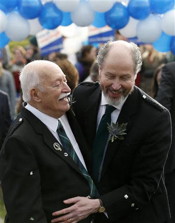 Larry Lamont and Jerry Slater (R) take part in a symbolic same-sex marriage outside the Scottish Parliament in Edinburgh, Scotland February 4, 2014. REUTERS/Russell Cheyne